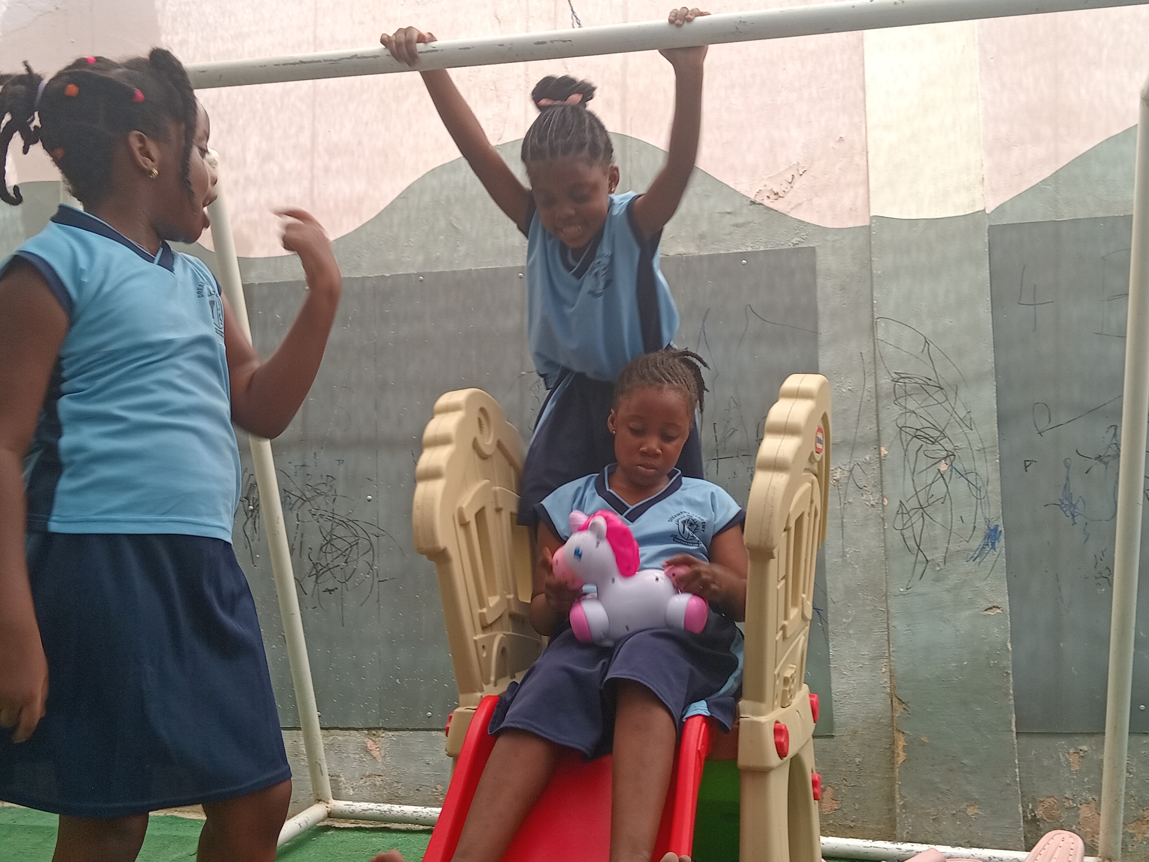 Primary school children smiling and engaged in classroom learning