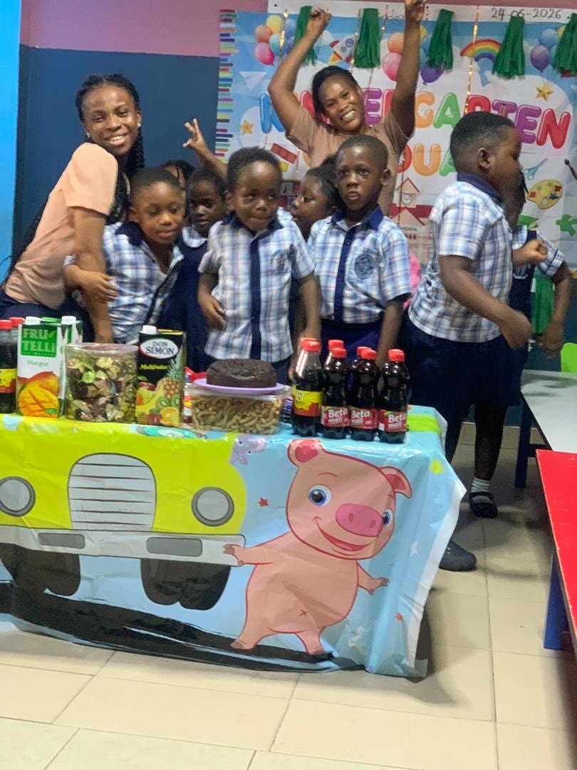 Teachers with students at the graduation party table