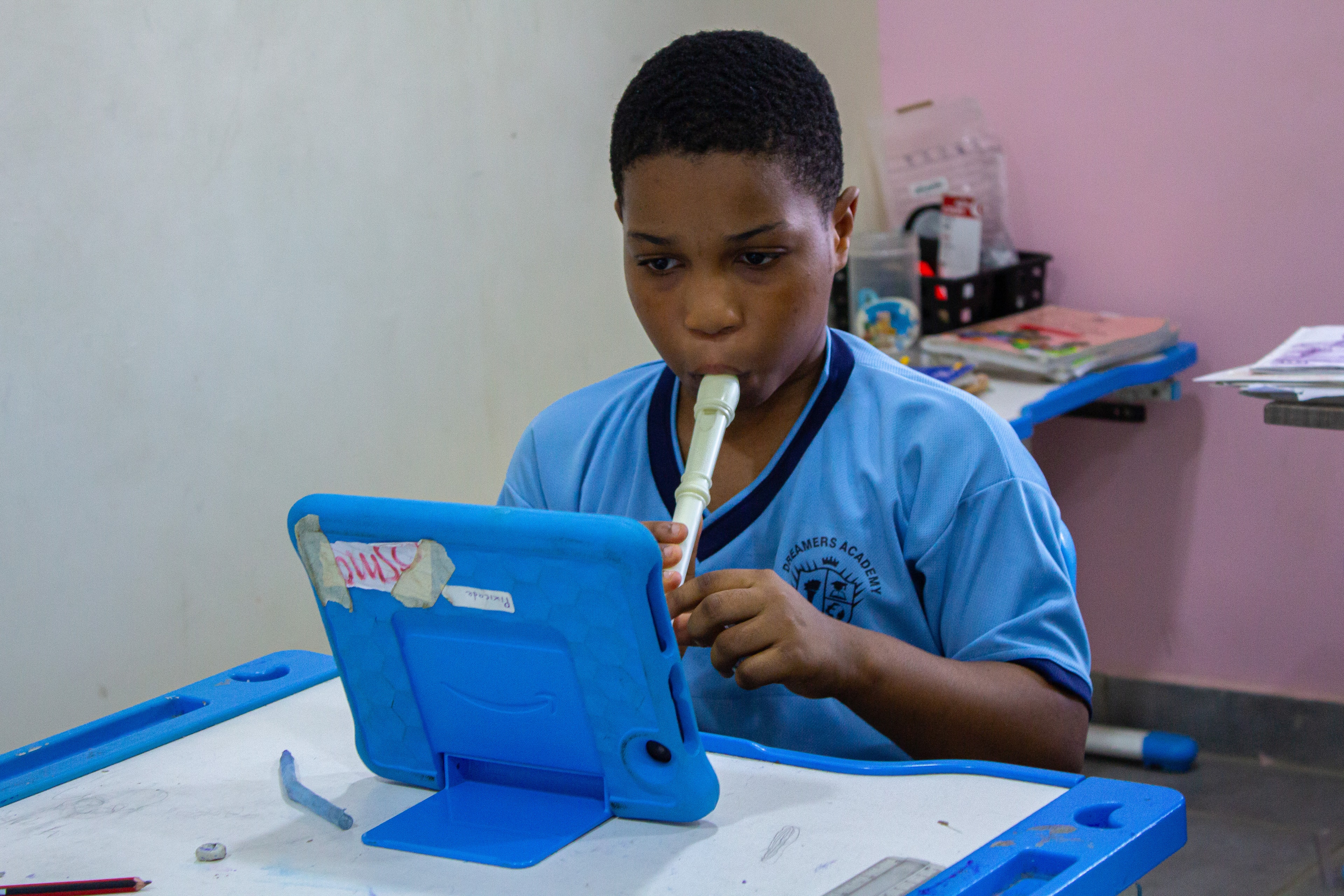 Children learning musical instruments at school